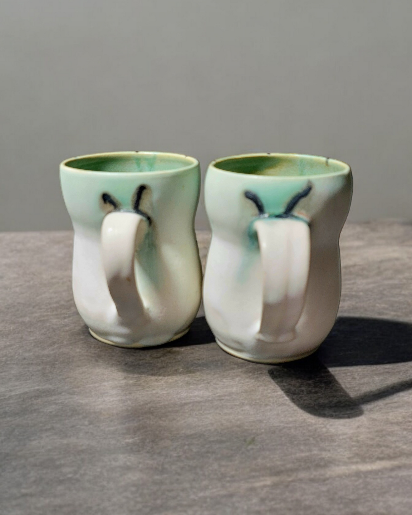 White and Pale Mint Cups with Abstract Lines