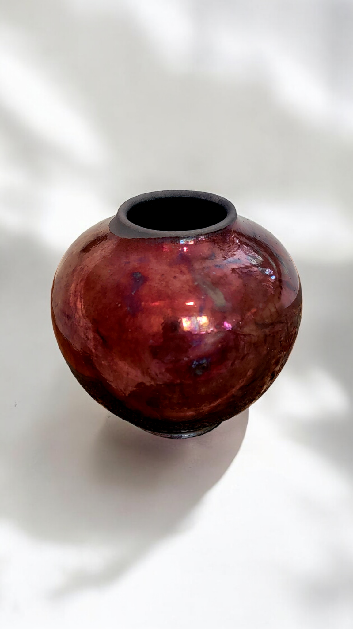 Small Round Raku Vase in Copper/maroon.